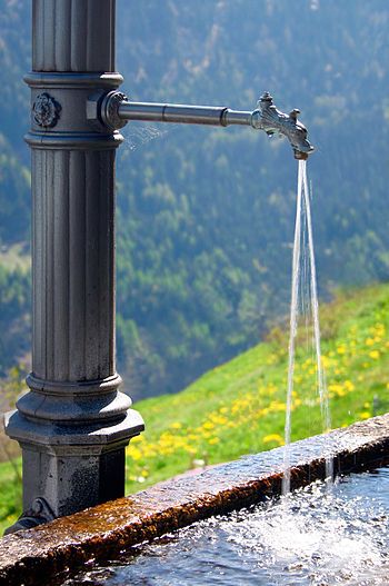 English: Water fountain found in a small Swiss...
